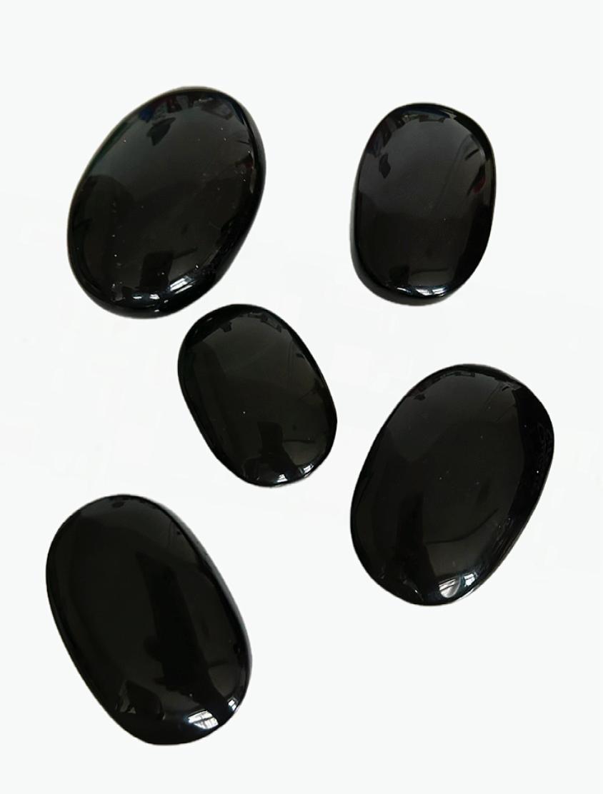 Obsidian palm stones
