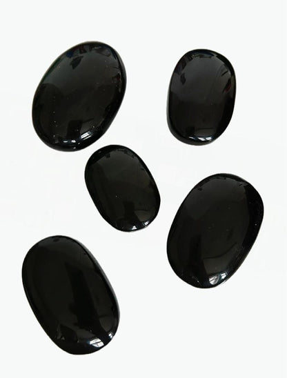 Obsidian palm stones